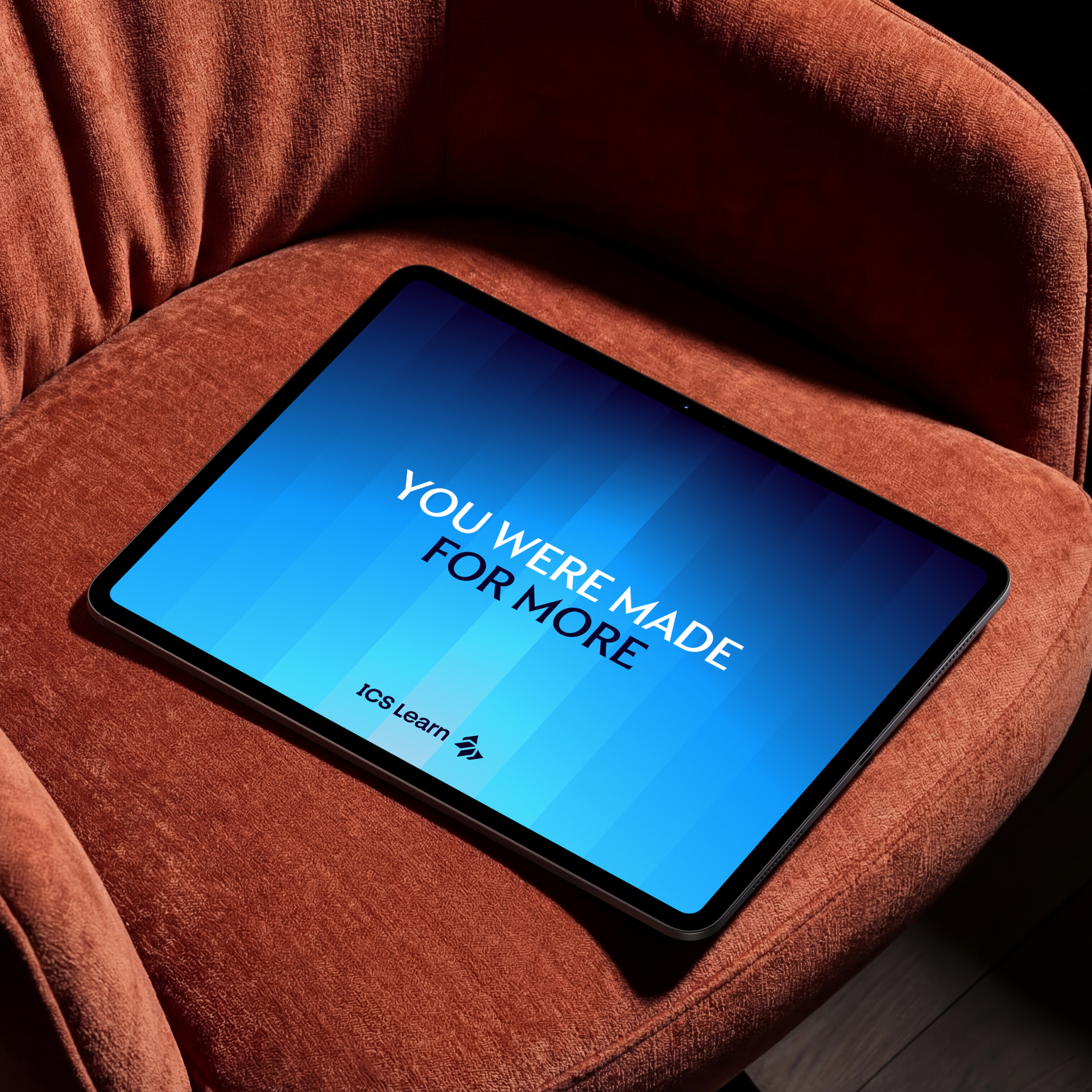 An ICS Learn screensaver on a tablet, with the words 'You were made for more' emblazoned on a bright blue gradient background