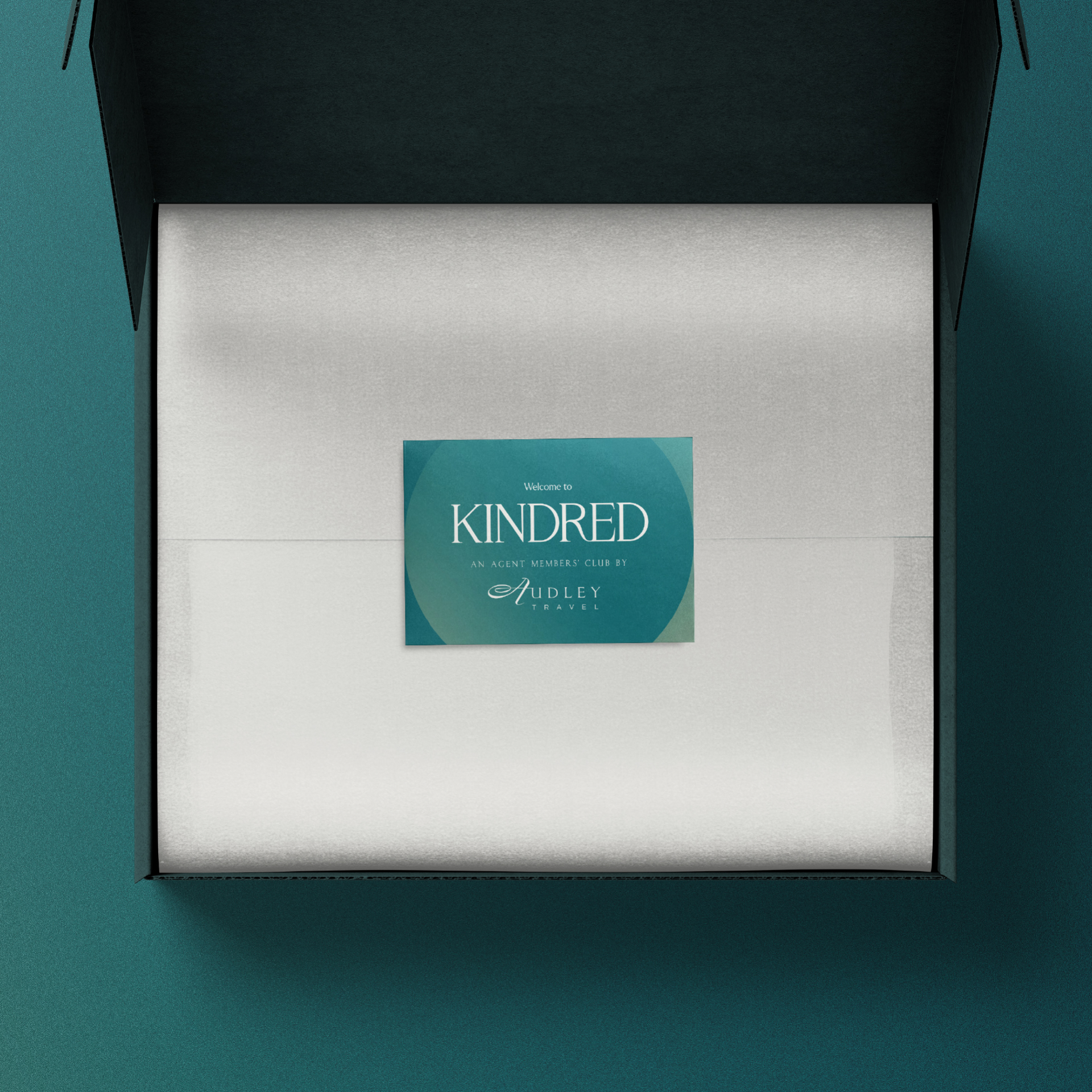 An open Kindred box with a welcome card inside