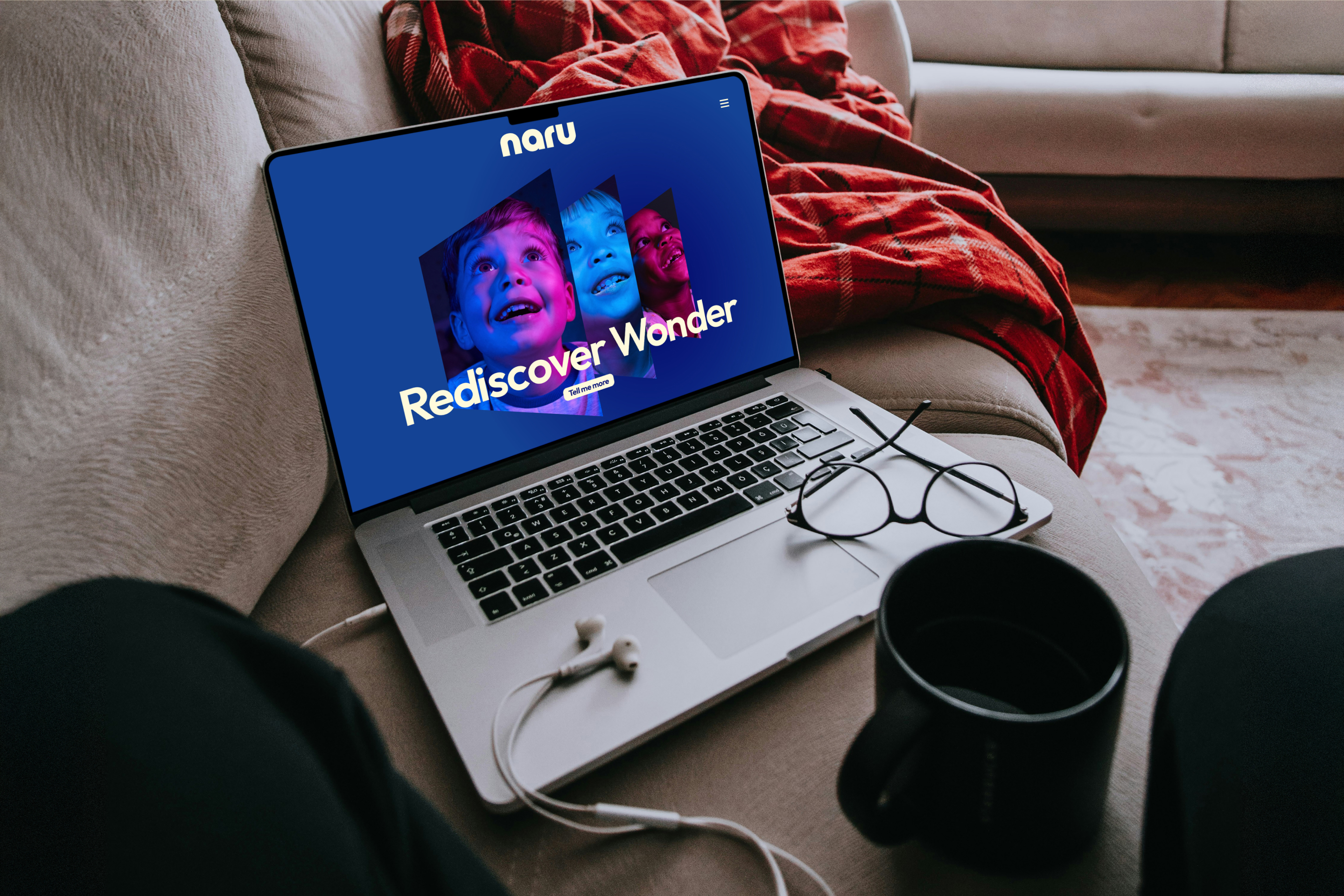 A laptop with the Naru website on its screen